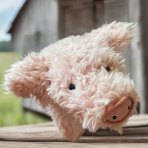 Stuffed animal seated piggy